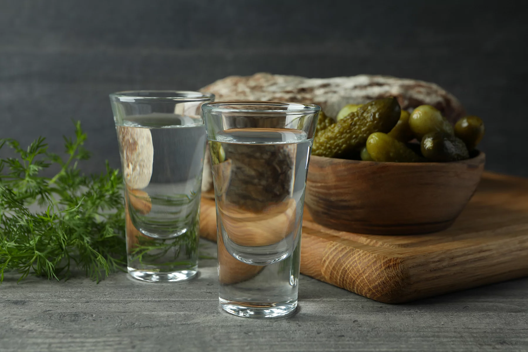 Vodka with pickles, bread, and dill
