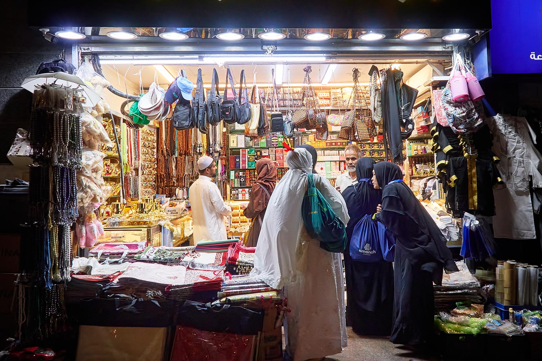A shop in Makkah with people haggling for price, a common occurrence in Saudi Arabia.