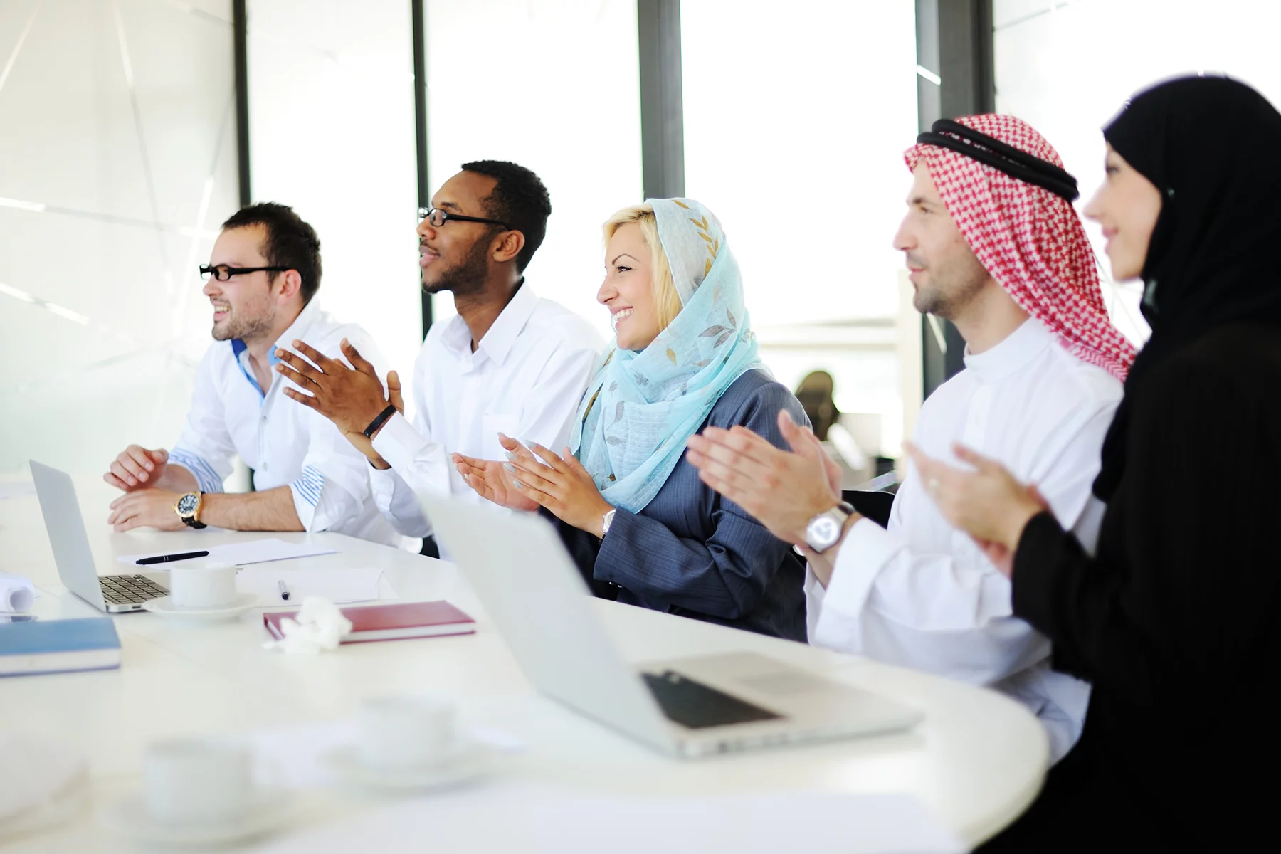 Diverse colleagues in an office in Saudi Arabia