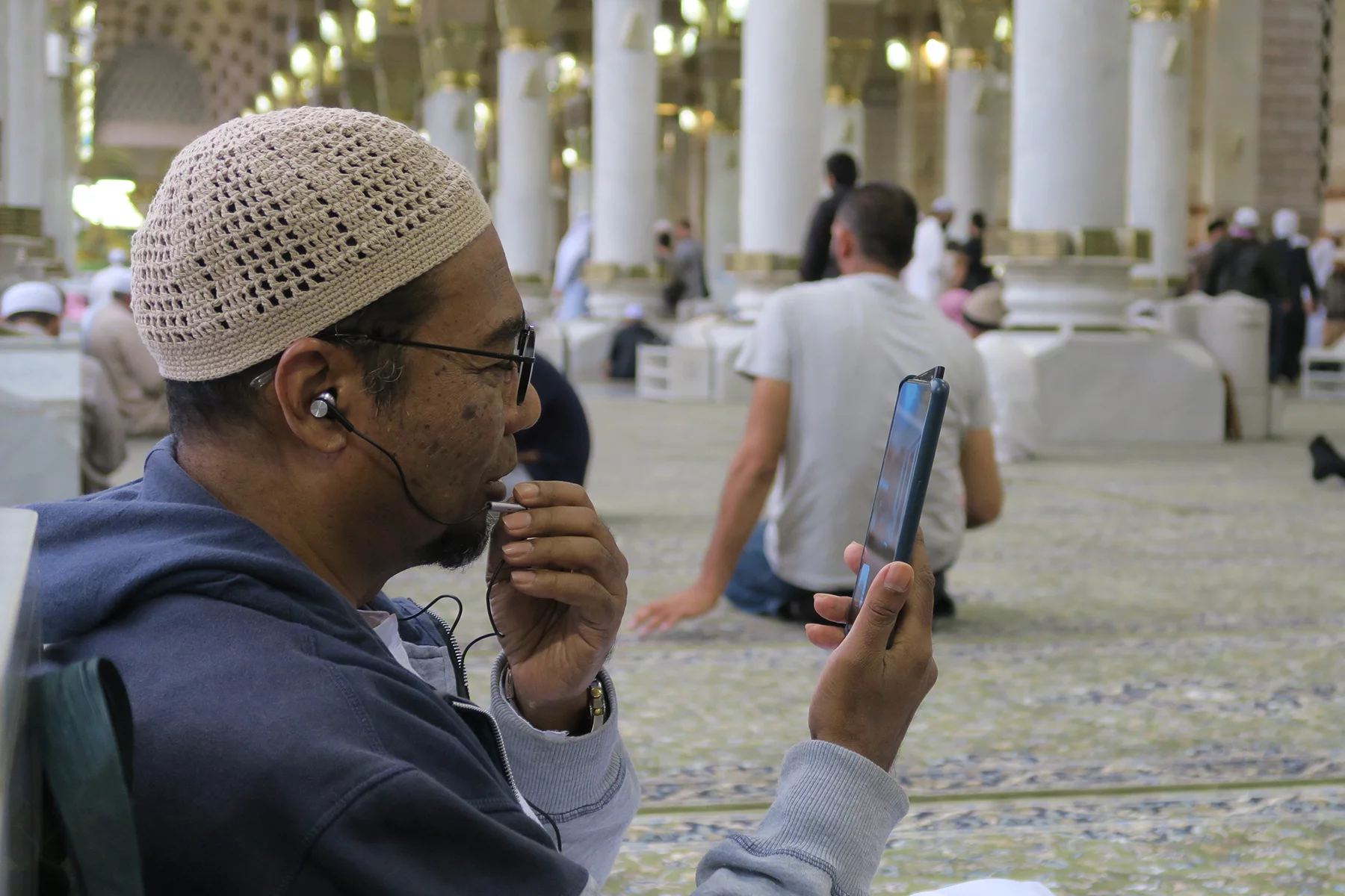 Man in Medina on a videocall on his mobile phone