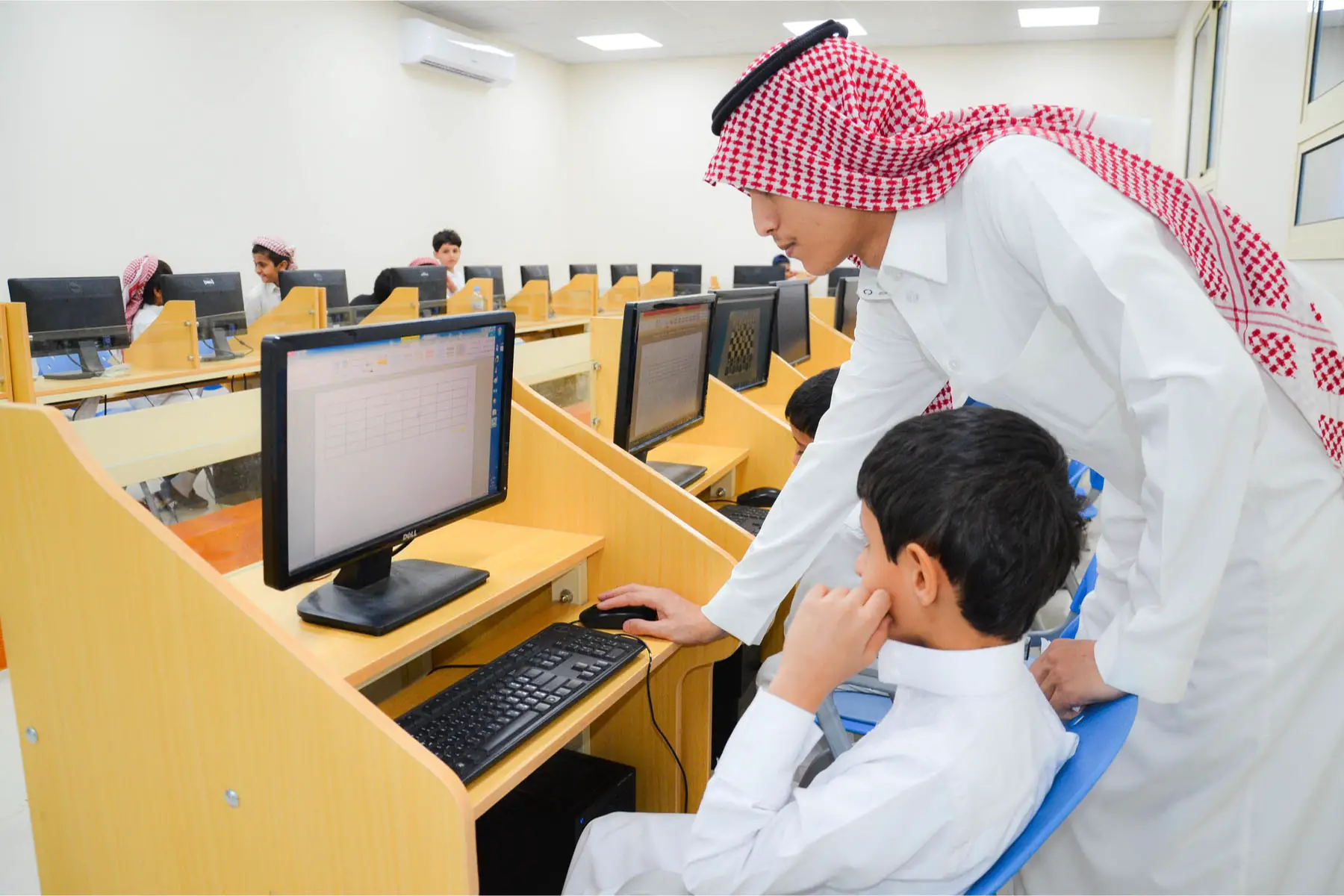 primary school pupil learning on a computer 
