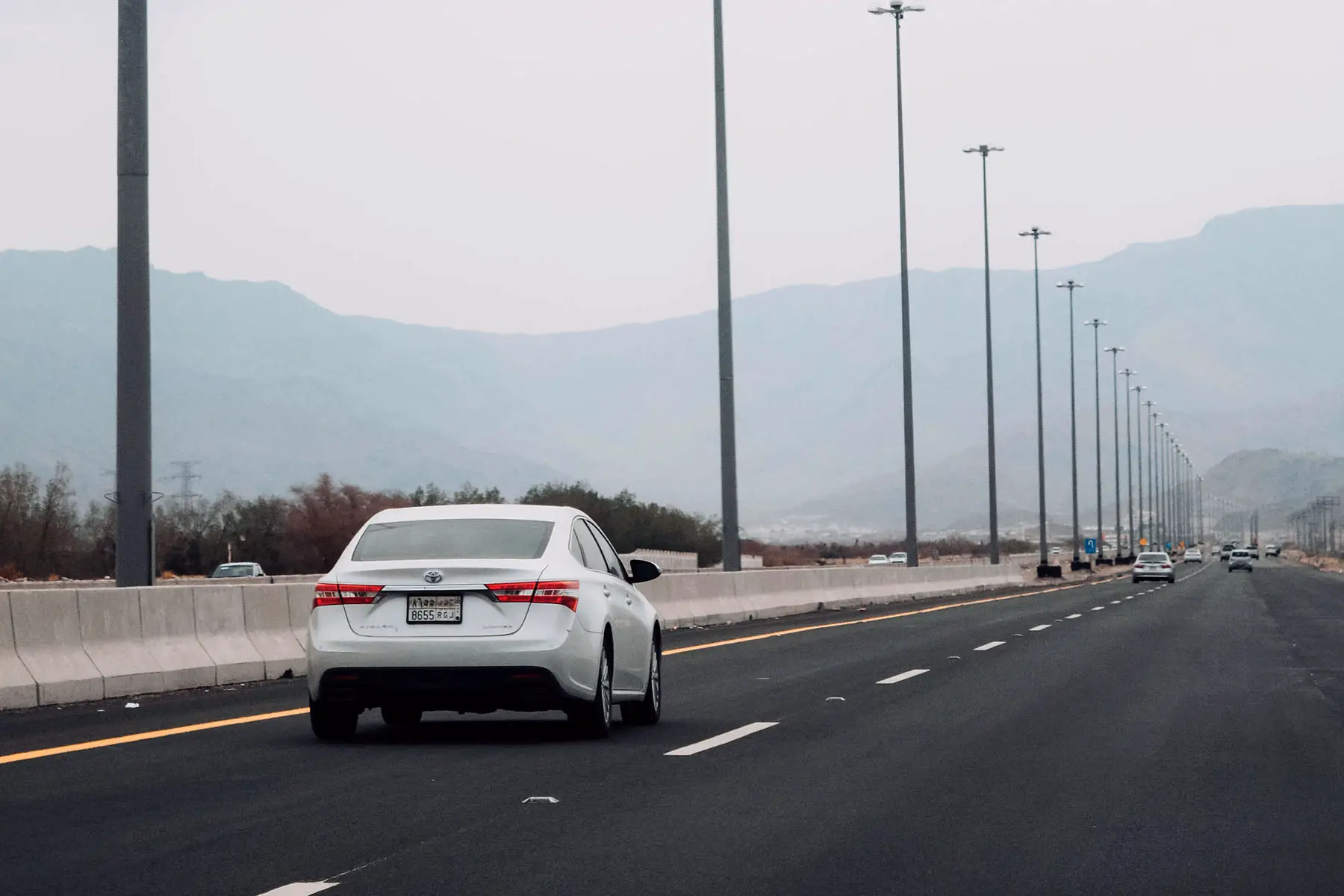 Toyota car driving on the road in Jeddah, Saudi Arabia.