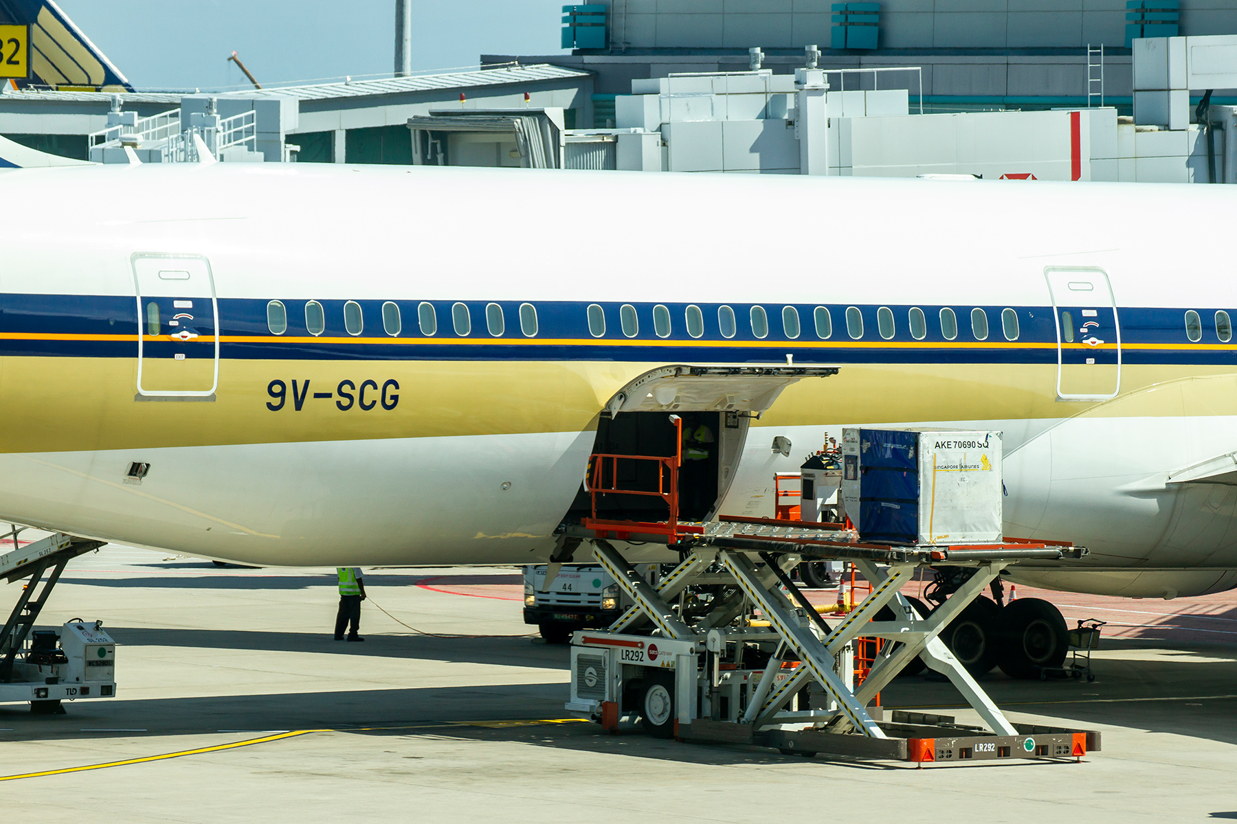 An airplane with cargo being loaded.