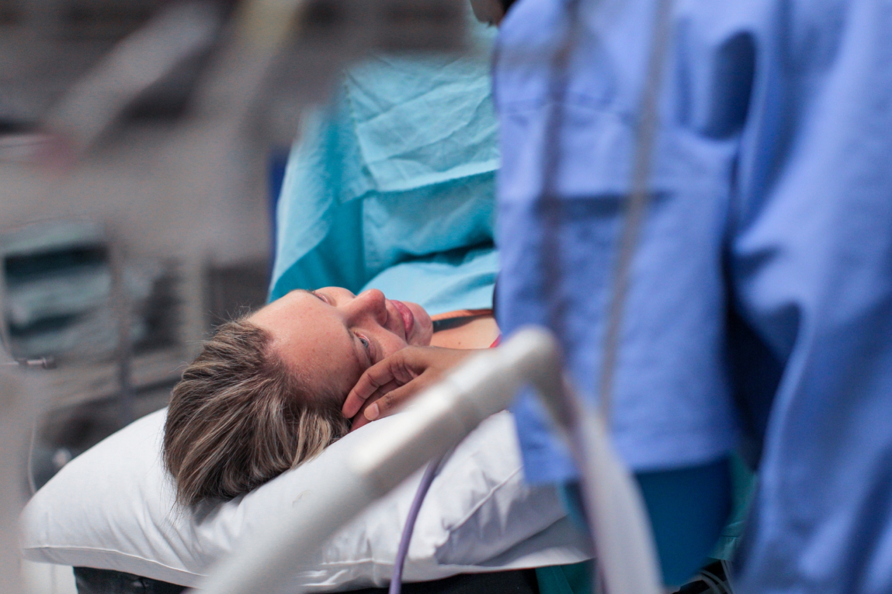 A pregnant woman laying on the operating table moments before having a cesarean section