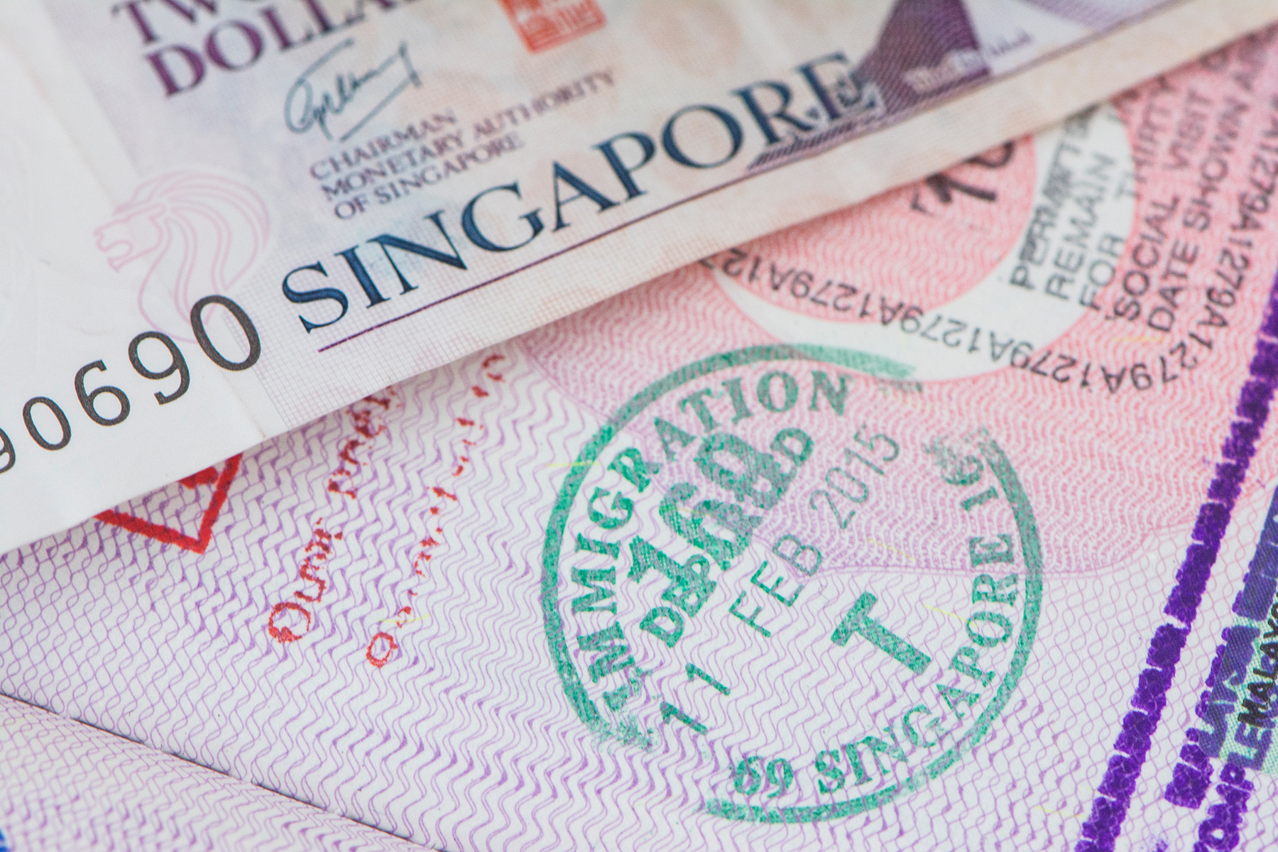 Close up of an immigration stamp for Singapore in a passport