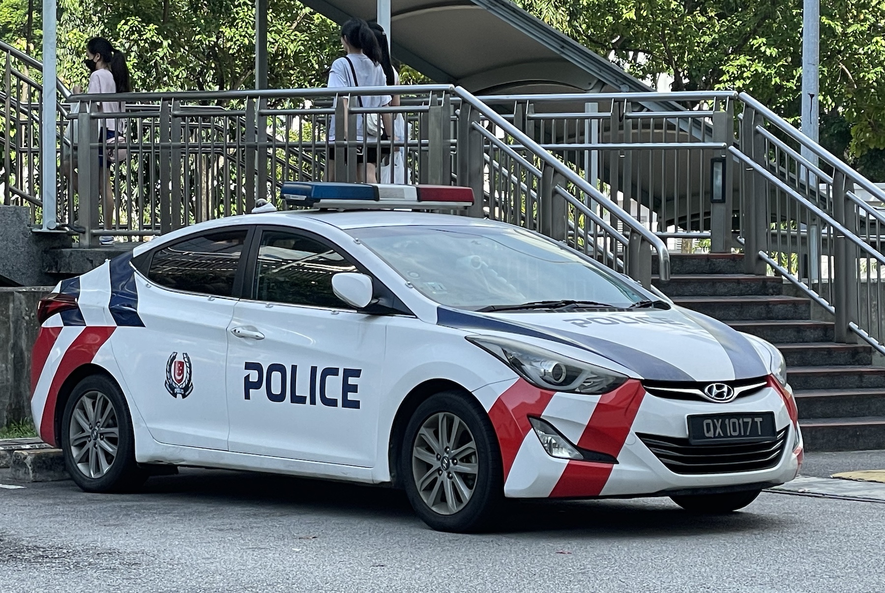 A parked SPF squad car sits outside the IMM Mall, Singapore

