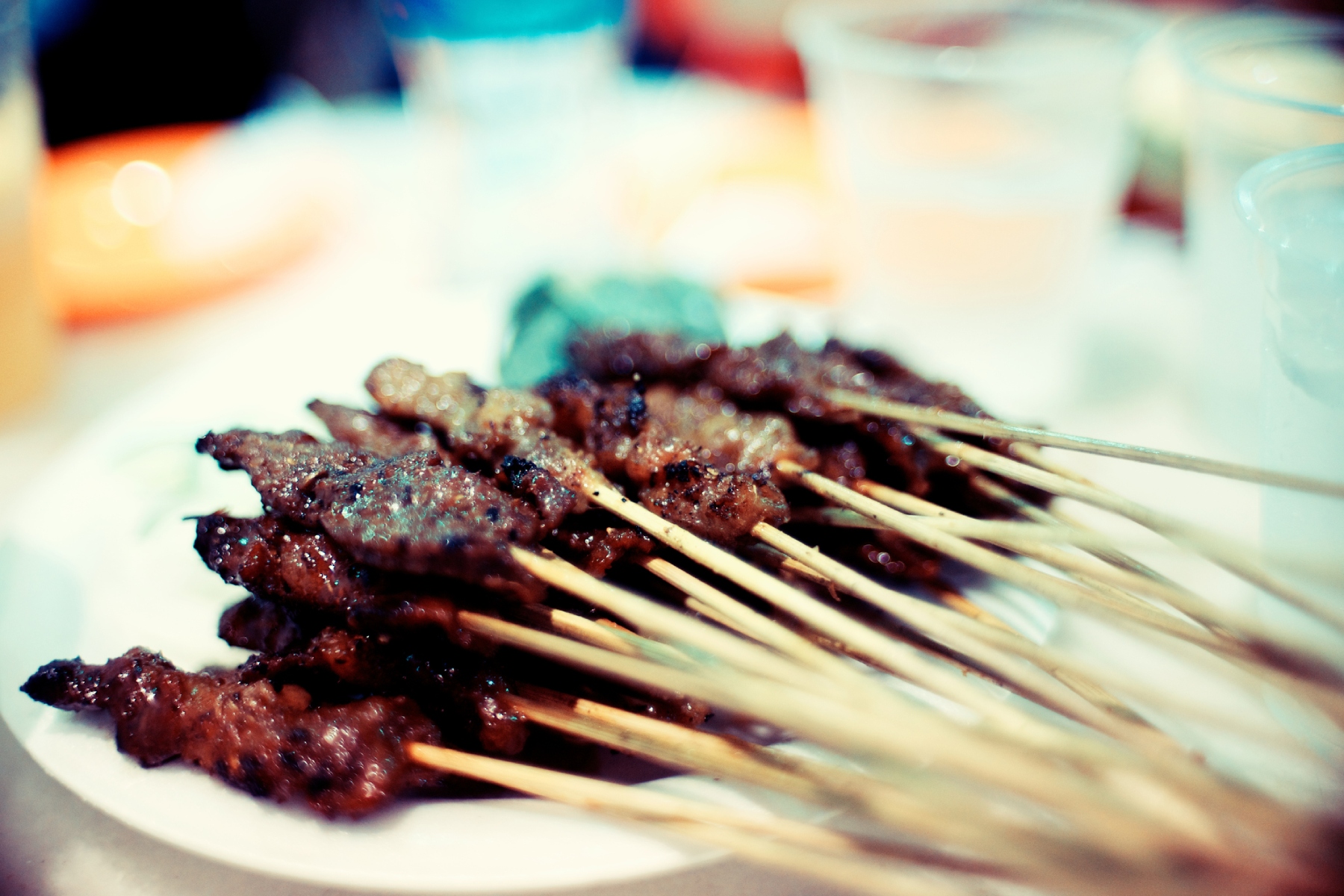 A close-up of a pile of grilled satay spiced meat, served in the famous hawker center in Lau Pa Sat.