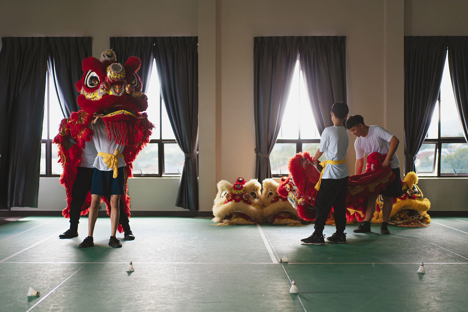 Young lion dance troupe performers preparing for training.