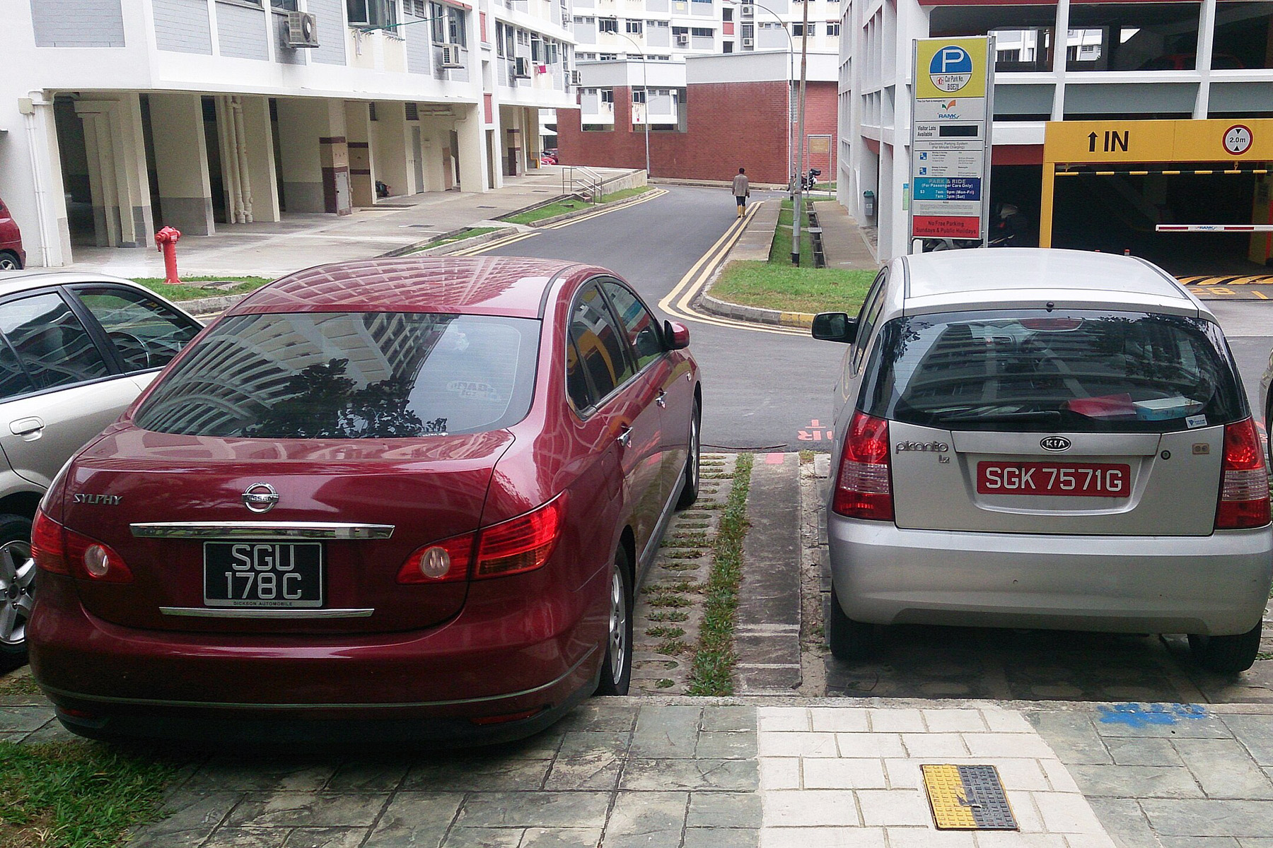 Regular and off-peak vehicle registration plates in Singapore.