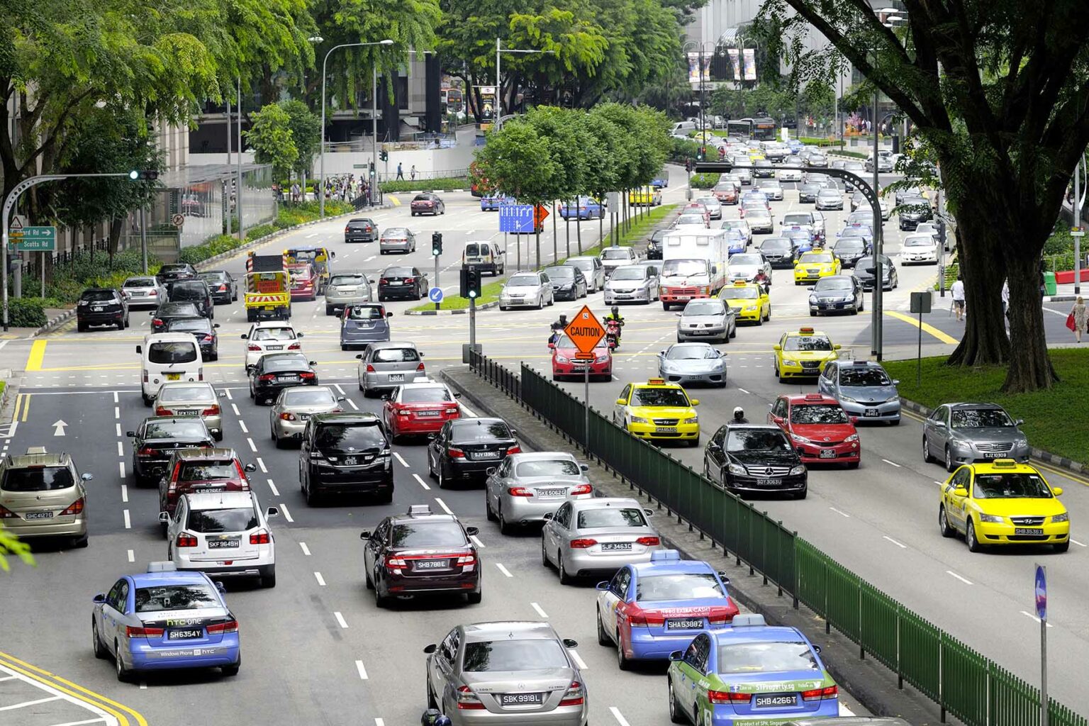 Busy intersection with traffic in Singapore.