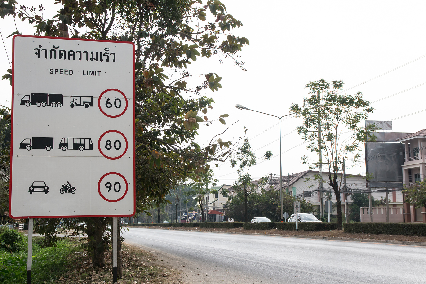 A sign displaying different speed limits for different vehicles.