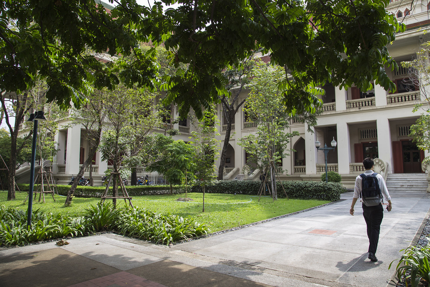 A student walks toward a building of Chulalongkorn University in Bangkok