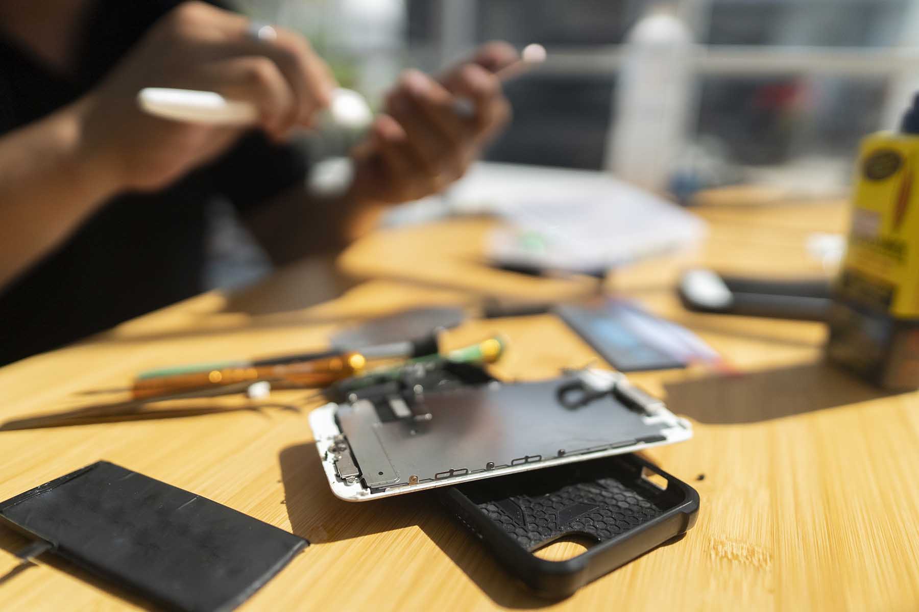 Close up of a mobile phone being repaired.
