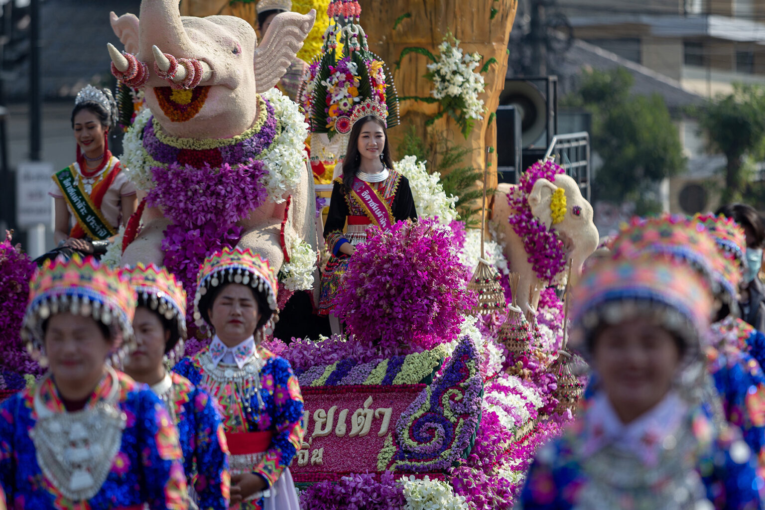 Colourfully dressed participants in the The Chiang Mai Flower Festival