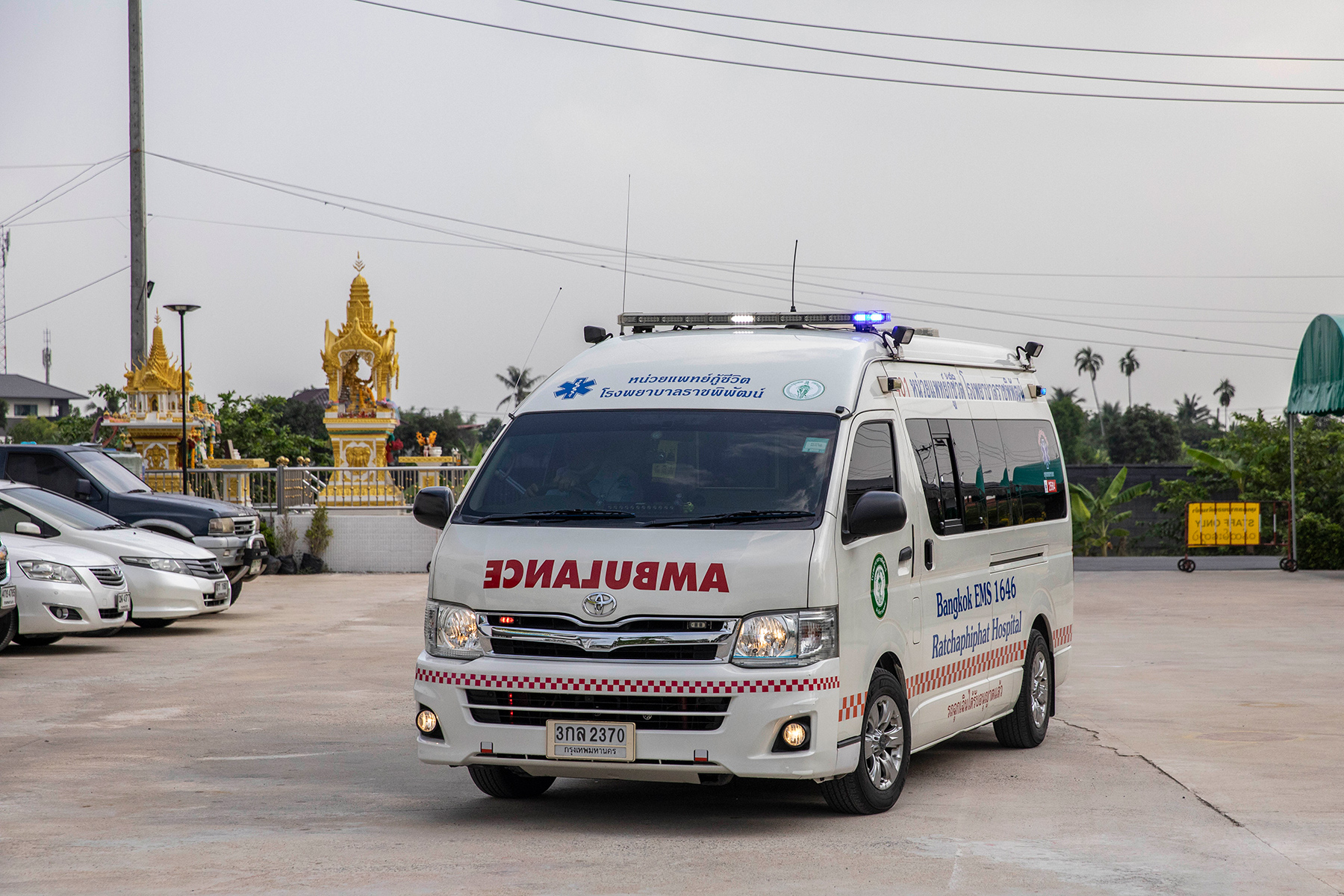 Ambulance in front of a Thai temple
