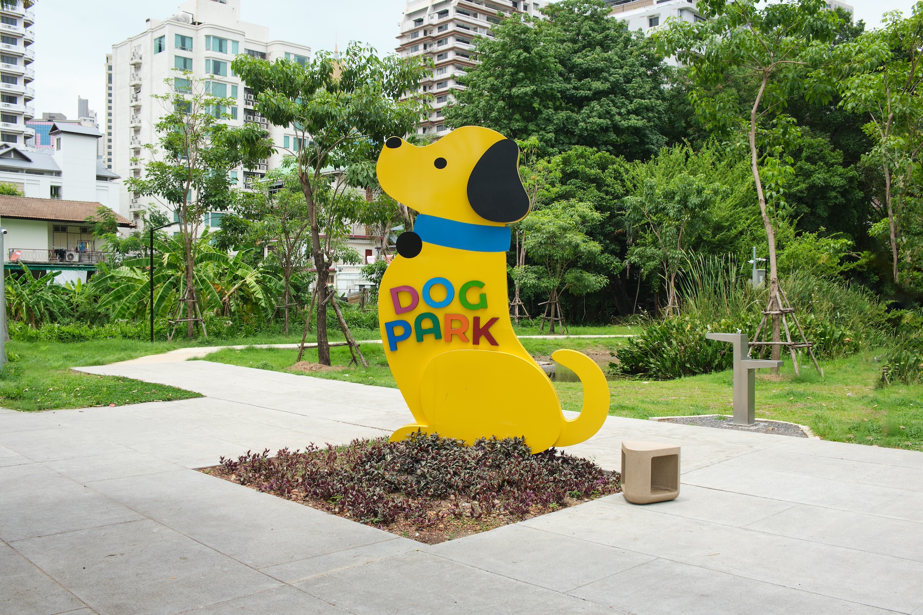 The entrance to a dog park in Benjakitti Park, Bangkok, Thailand is marked by a large dog-shaped sign