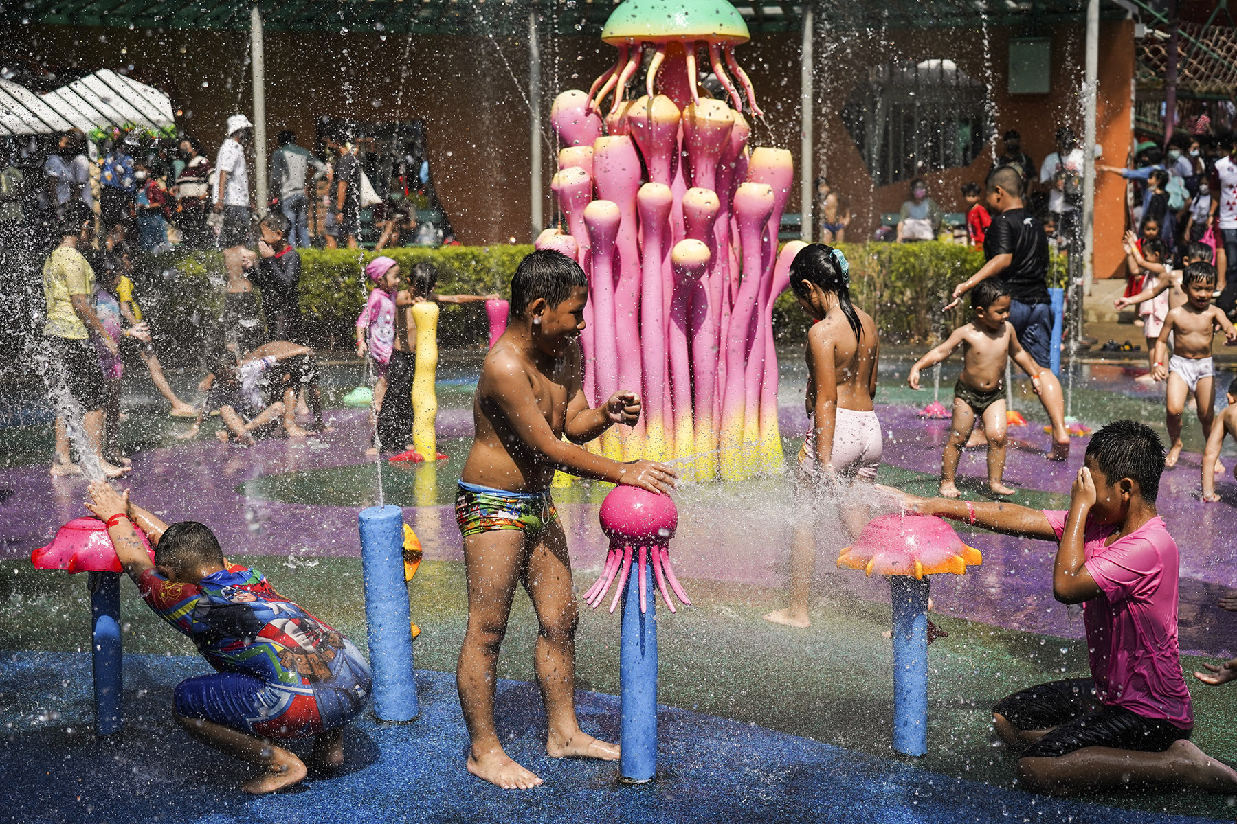 Children play in the water during the National Children's Day event inside children's museum in Bangkok, Thailand.