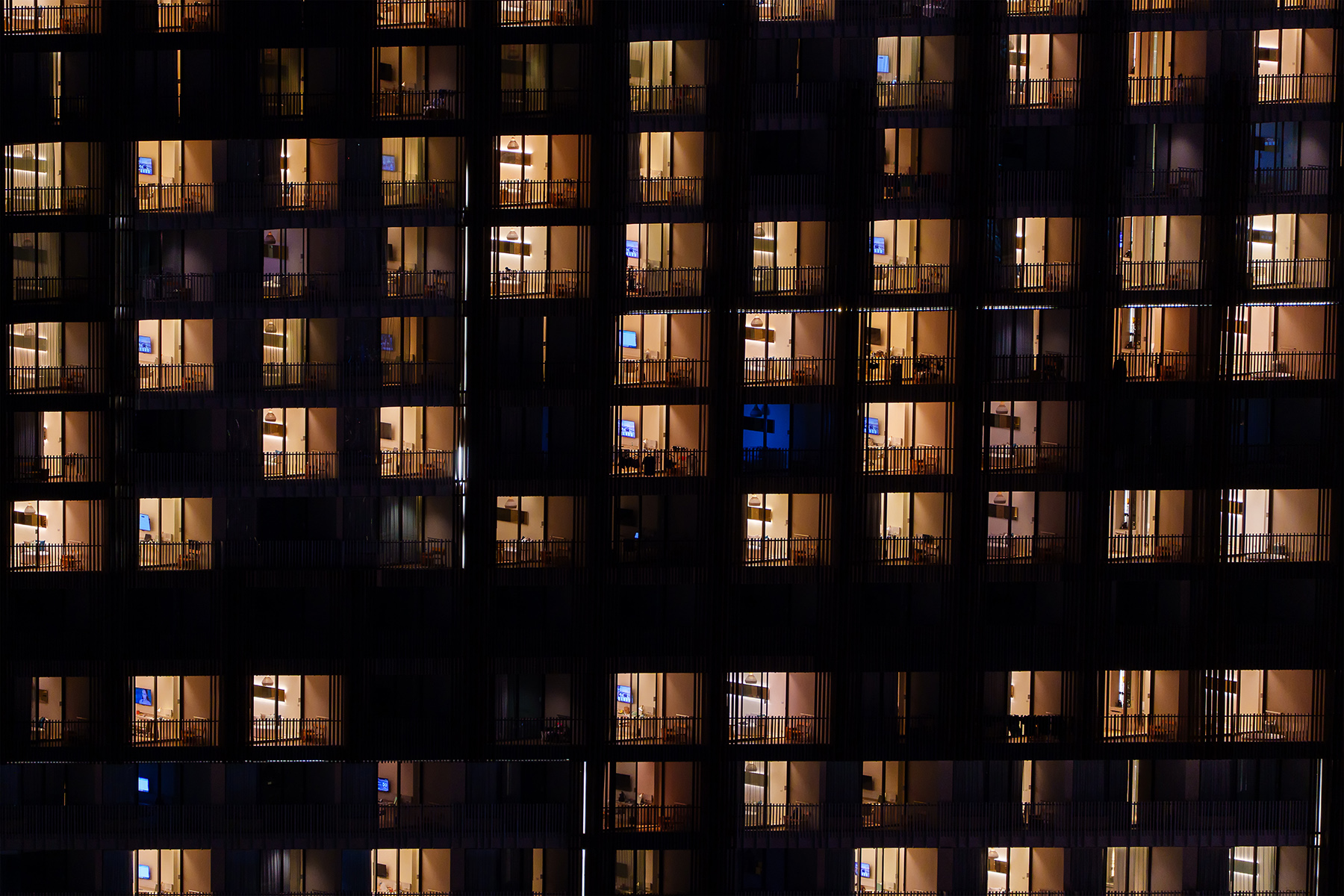 Illuminated windows of an apartment building in Thailand


