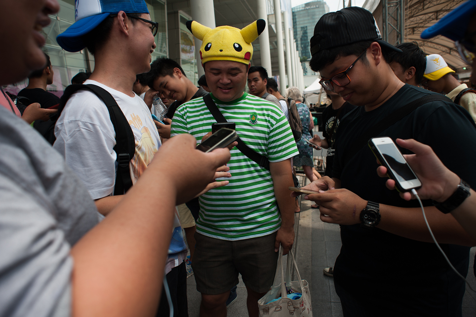 Thai 'Pokemon Go' players gather to play the game on their smartphones at a shopping mall in Bangkok, Thailand

