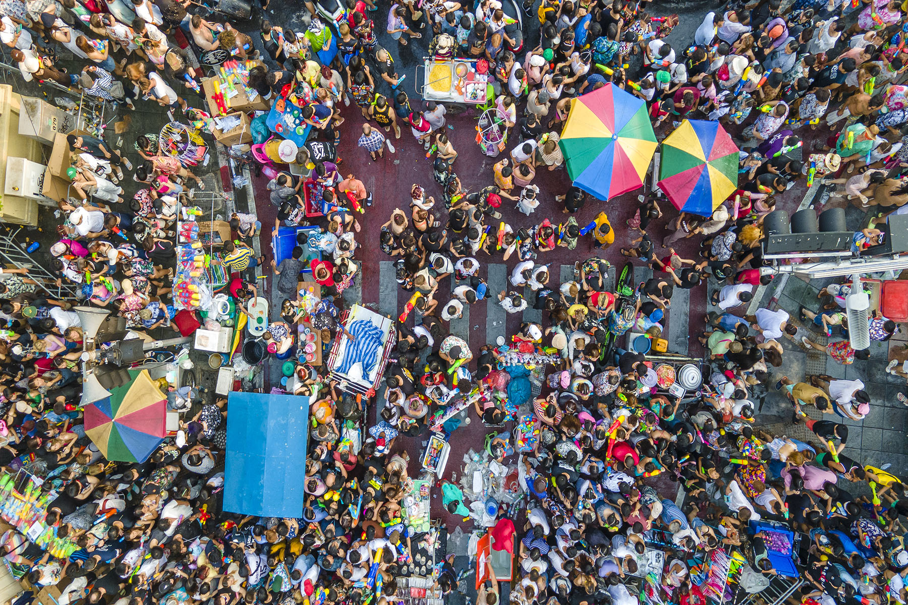 aerial view of a large crowd celebrating the Songkran Festival in Thailand