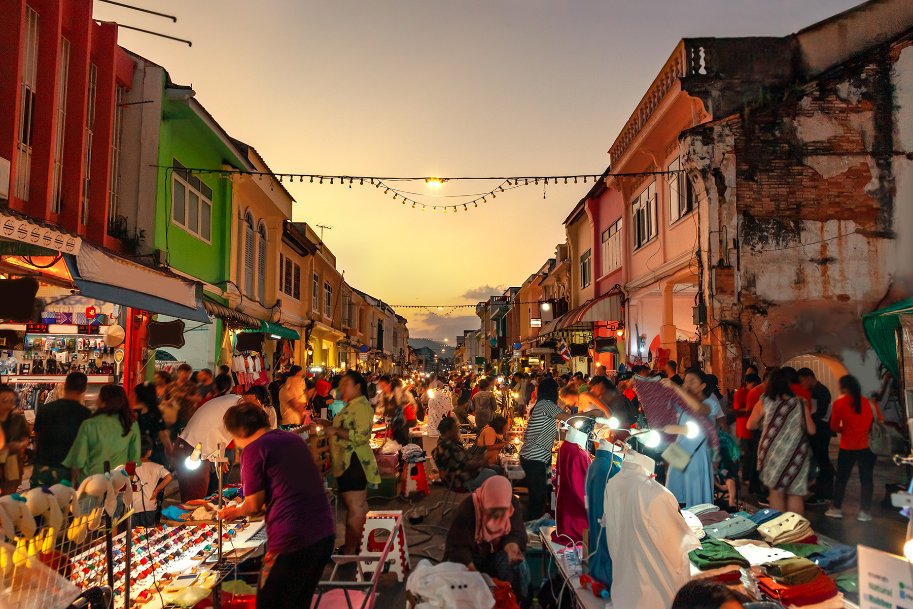 People at a night market in Phuket, Thailand, buying and selling



