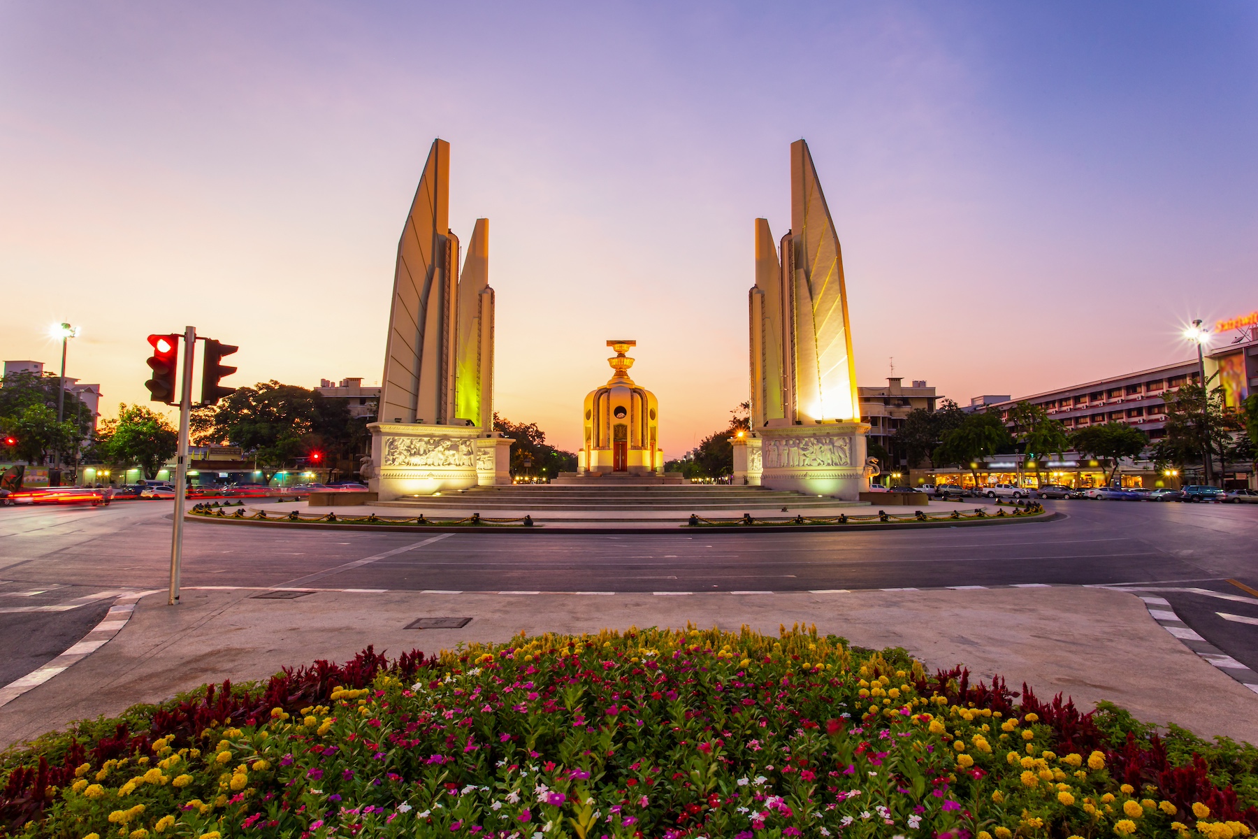 The Democracy Monument in Bangkok, Thailand, as shown from across the street at dusk