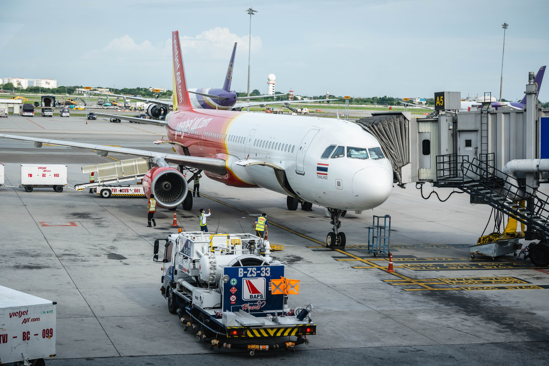 Thai Vietjet plane refuelling on runway at Suvarnabhumi Airport in Bangkok 