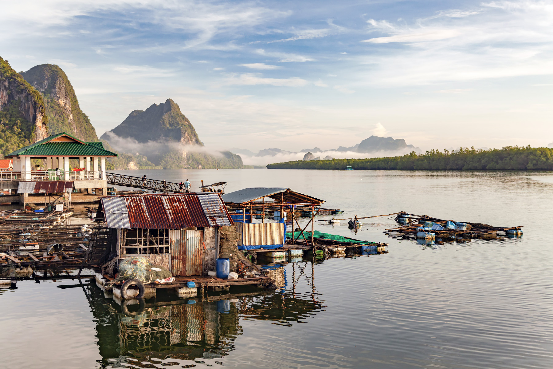 Fishing village of Phang-nga, Thailand, bordering the Andaman Sea on the west coast of the Malay Peninsula. Houses are surrounded by water, but seem to be safe for now.