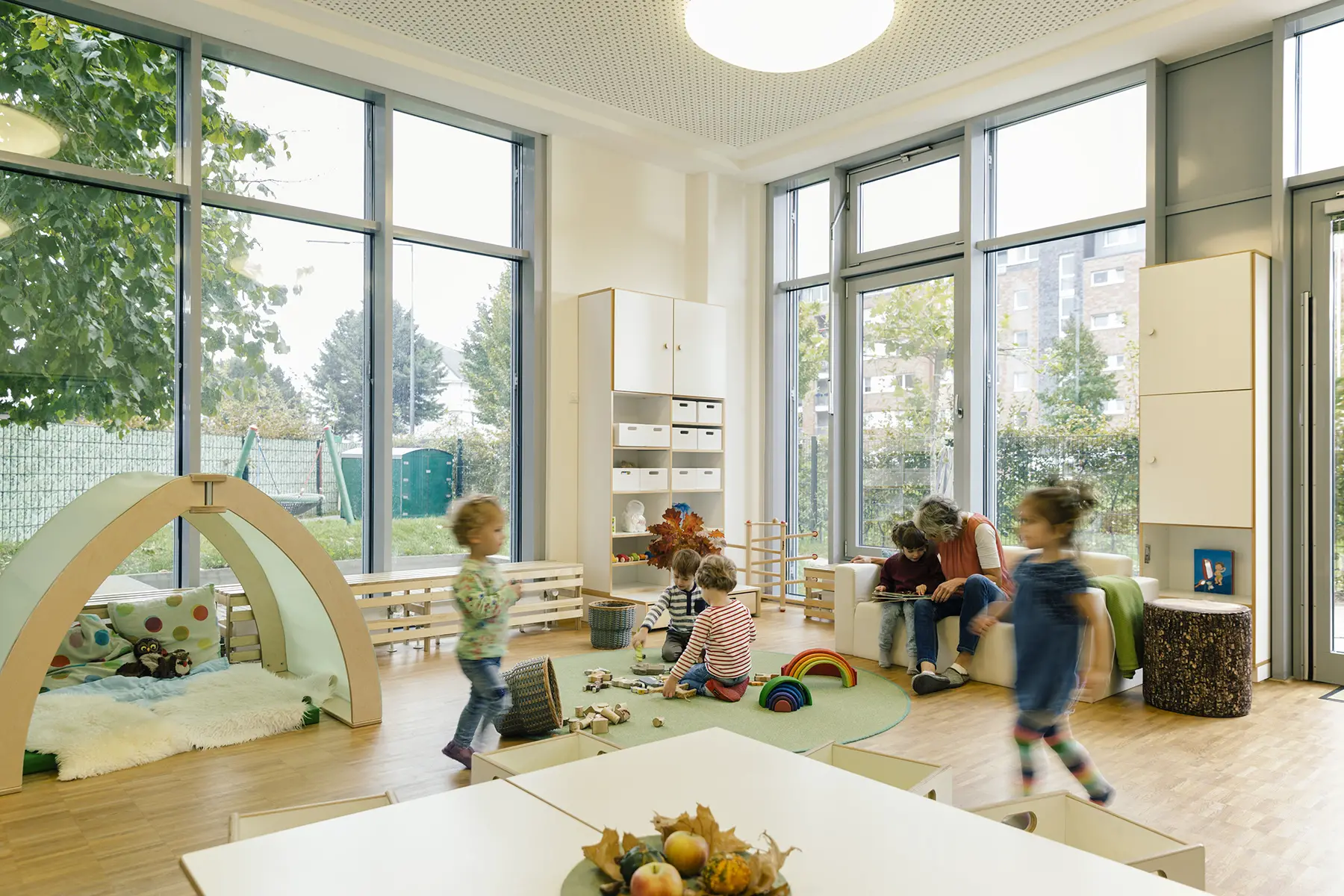 Children playing in a nursery/daycare room