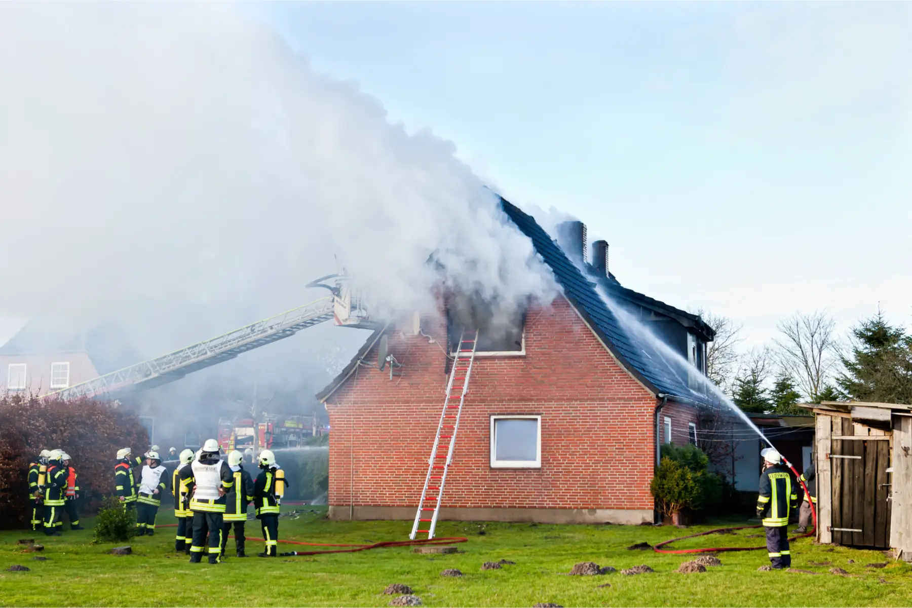 Firefighters battling a house fire in the UK