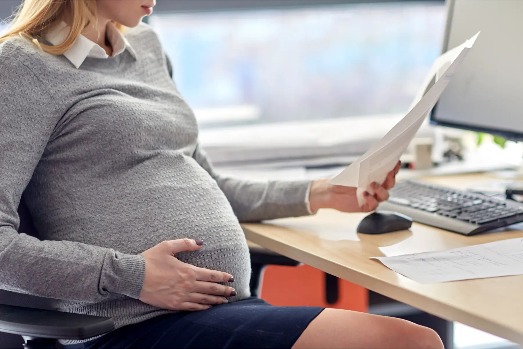 Pregnant woman at the office