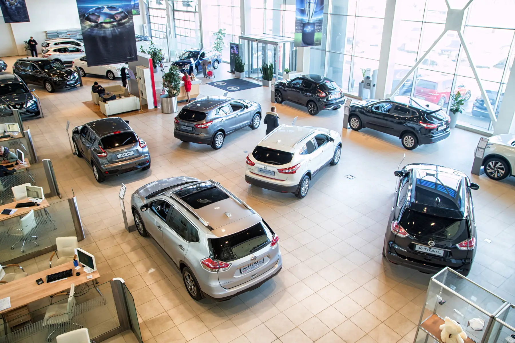 new cars displayed in car dealership showroom