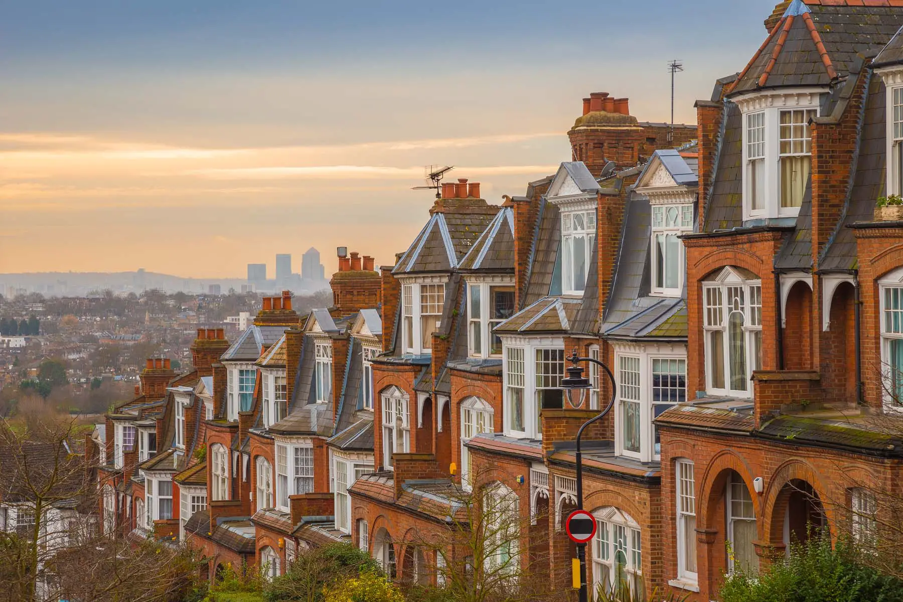 terrace houses in London with view out over the city at sunrise