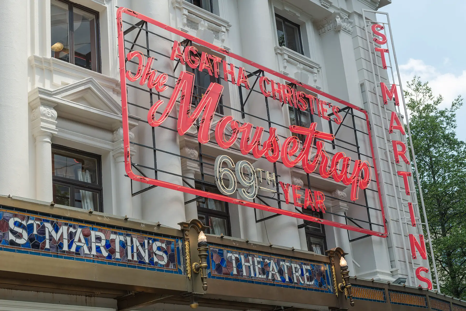 St Martin's Theater with a sign for The Mousetrap