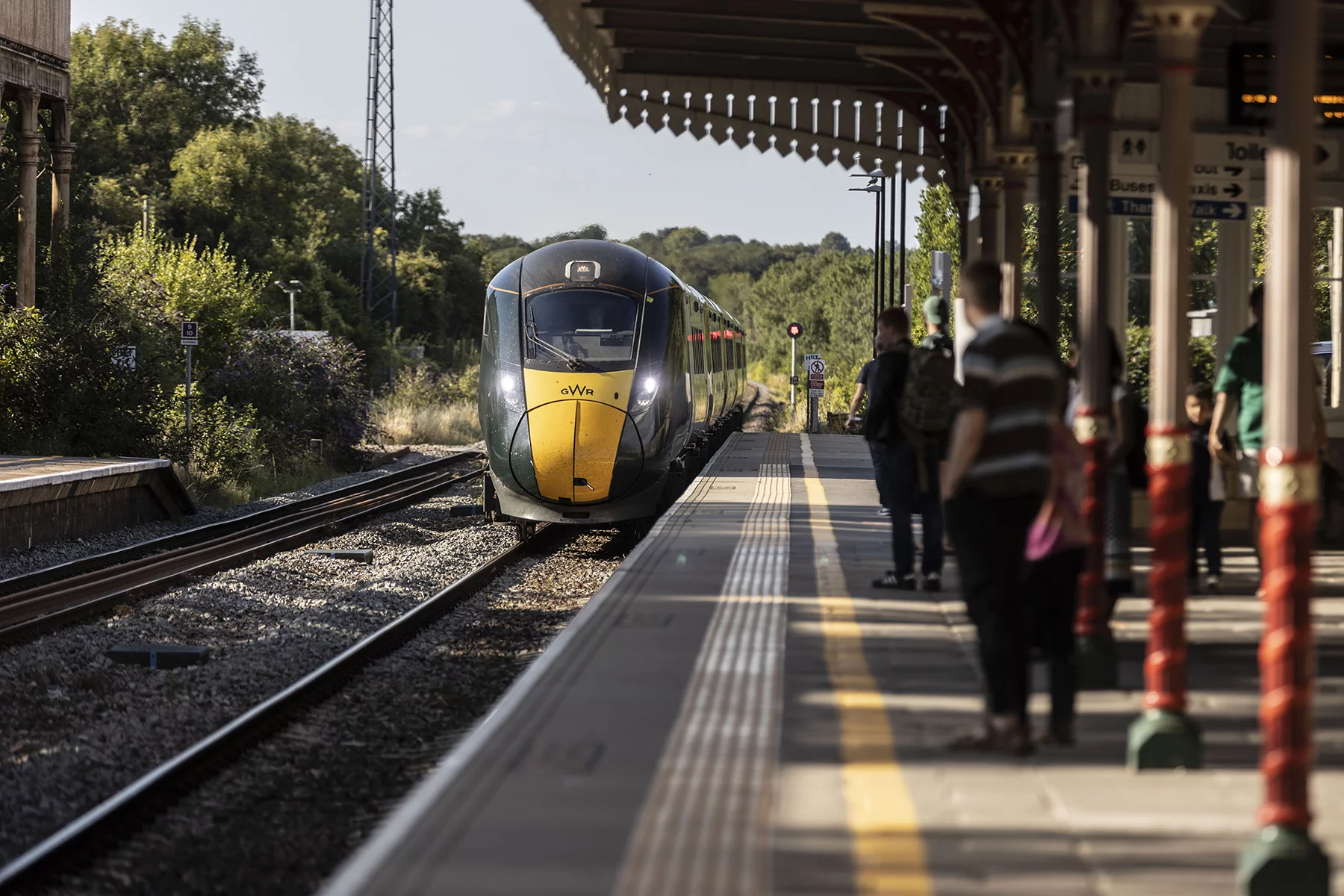 Train approaching a station platform in the UK
