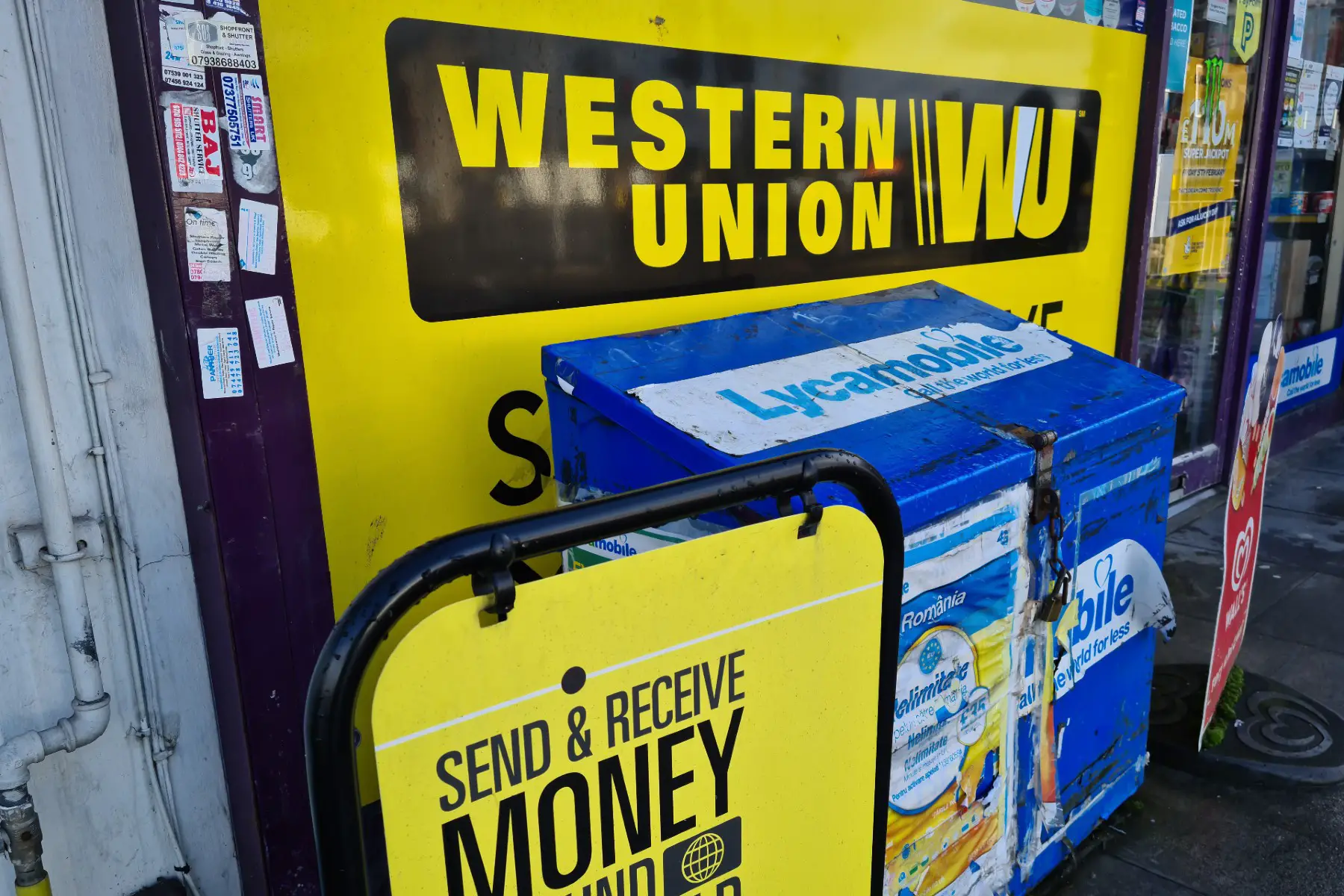 storefront of a local agent for wire transfer service Western Union in London, UK