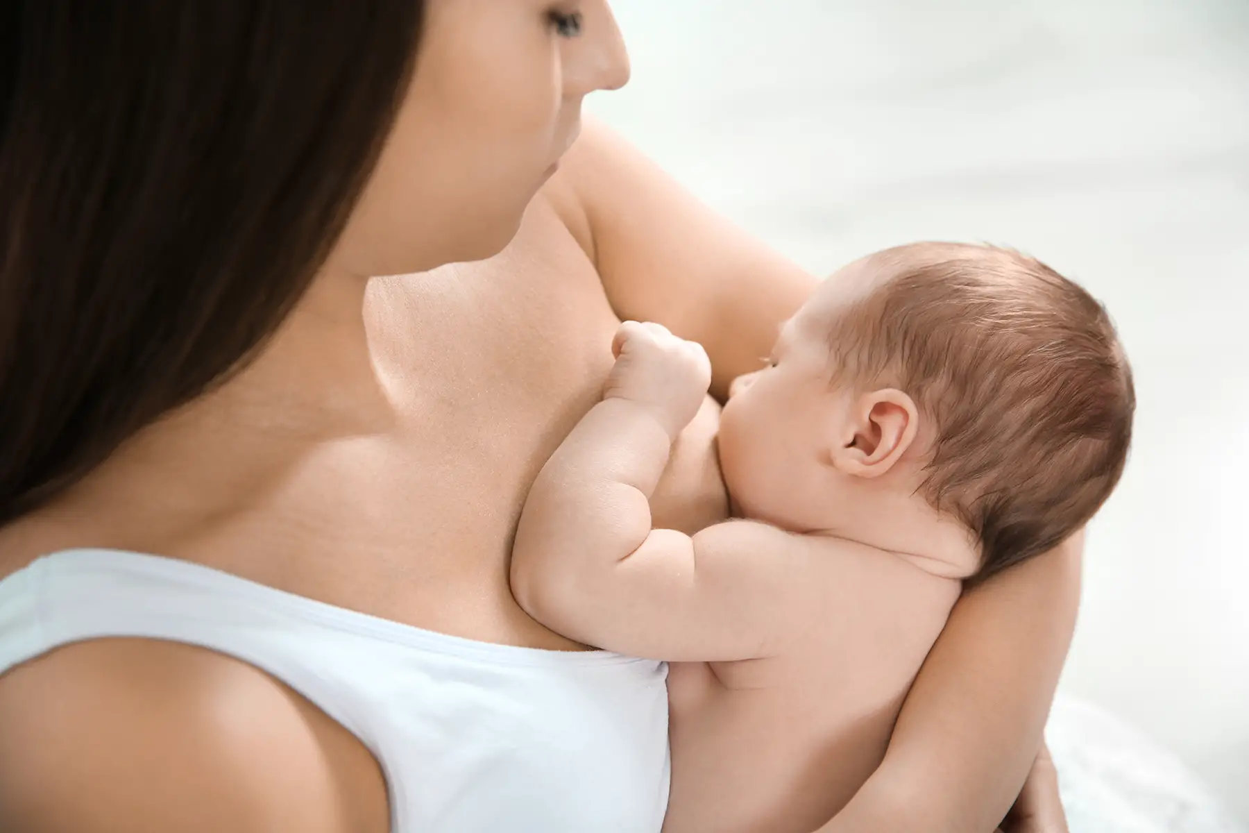 womens health uk: a woman breastfeeding her baby