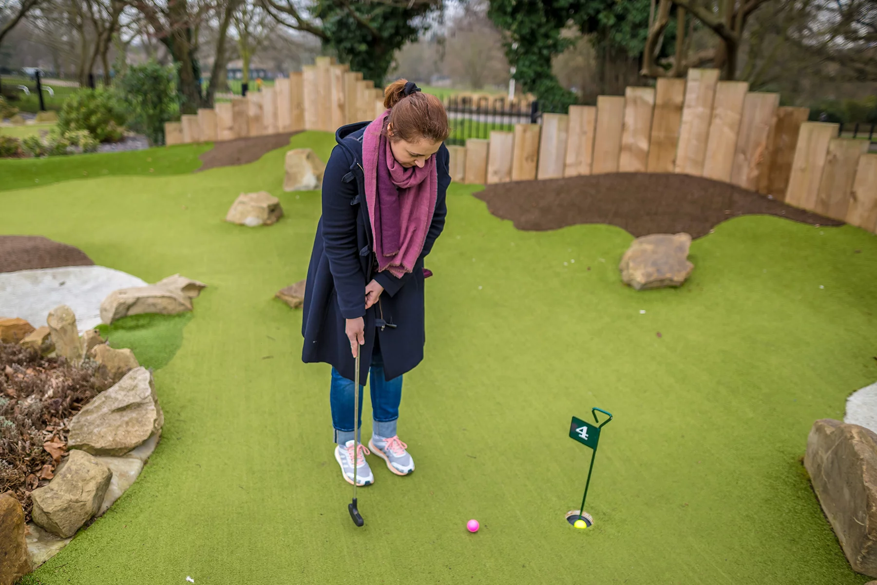 Woman playing miniature golf