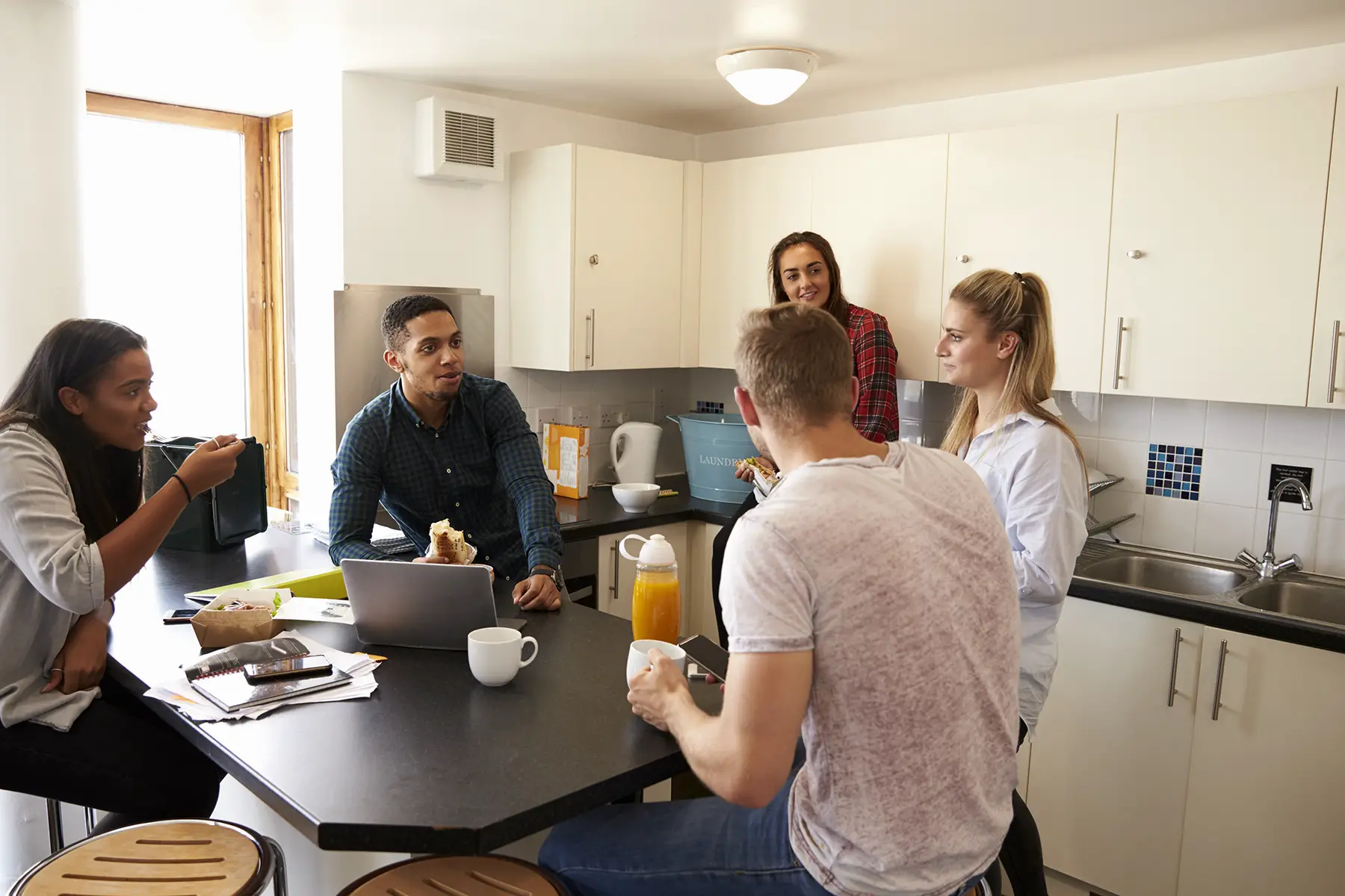 Young people in a shared kitchen