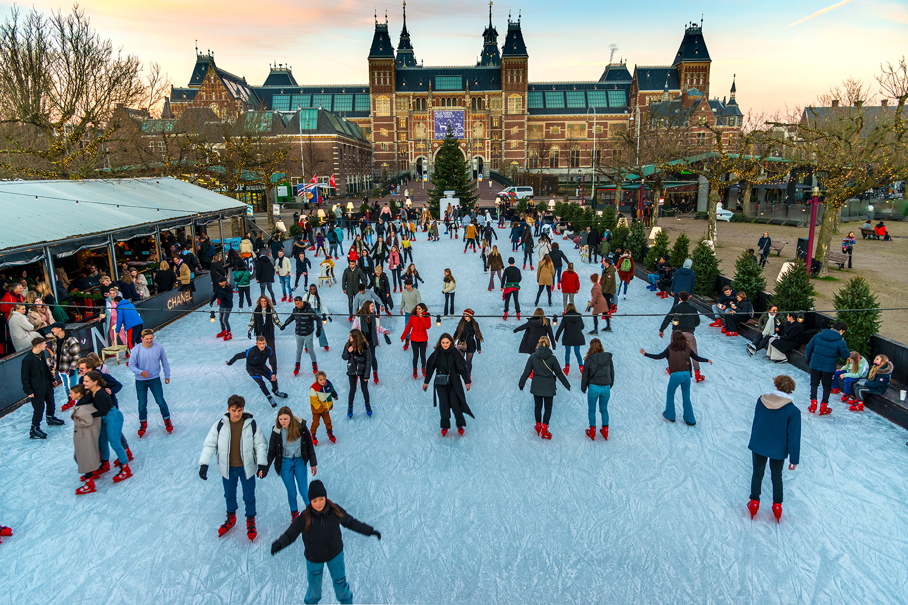 People ice skating on a rink outside the Rijksmuseum in the Netherlands