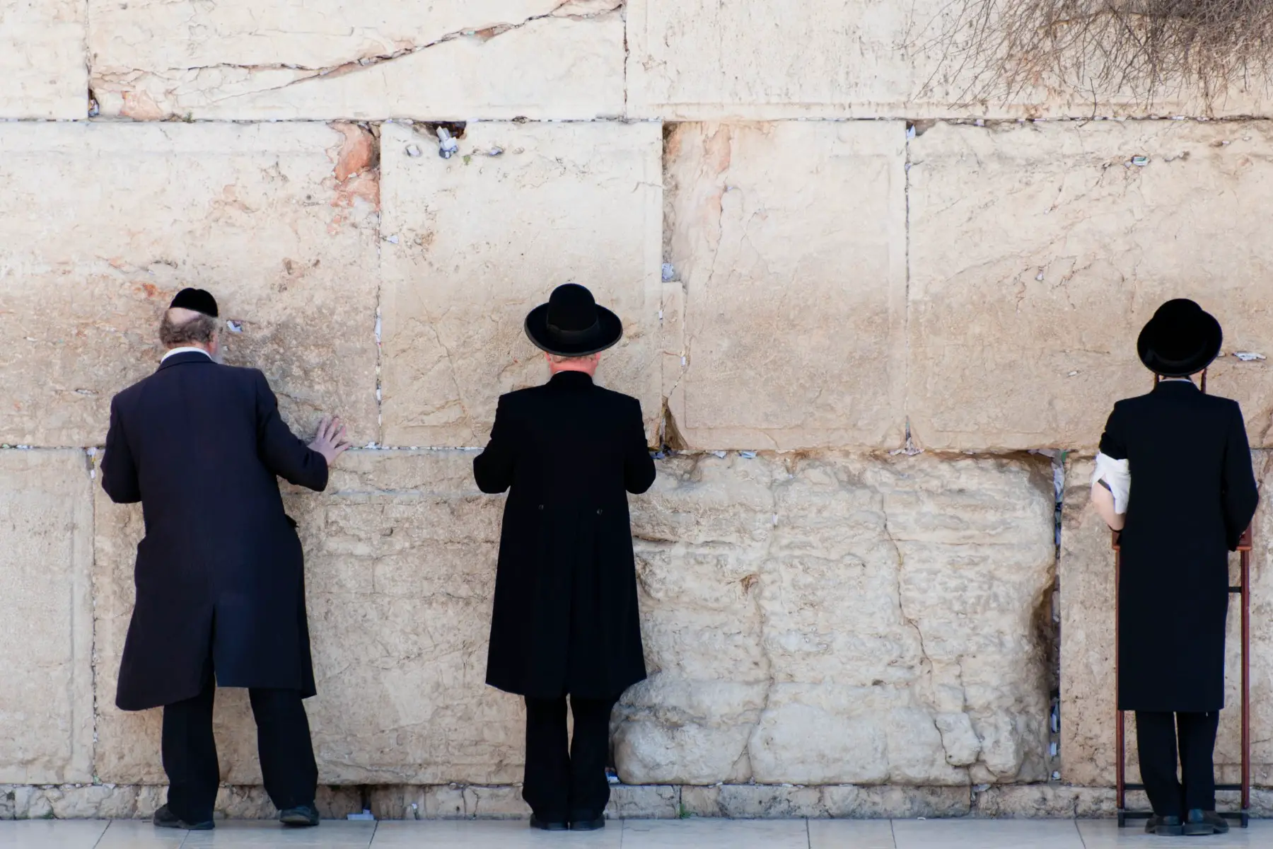 Orthodox Jewish men praying at the Wailing Wall in Jerusalem, Israel.