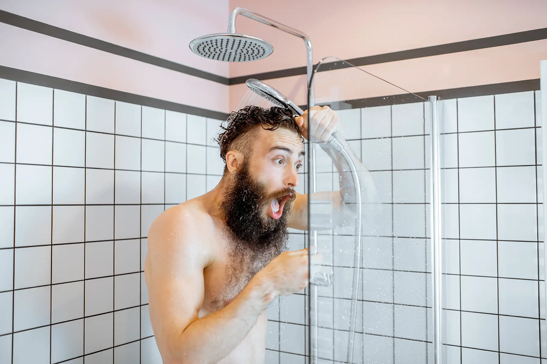 Surprised man in shower