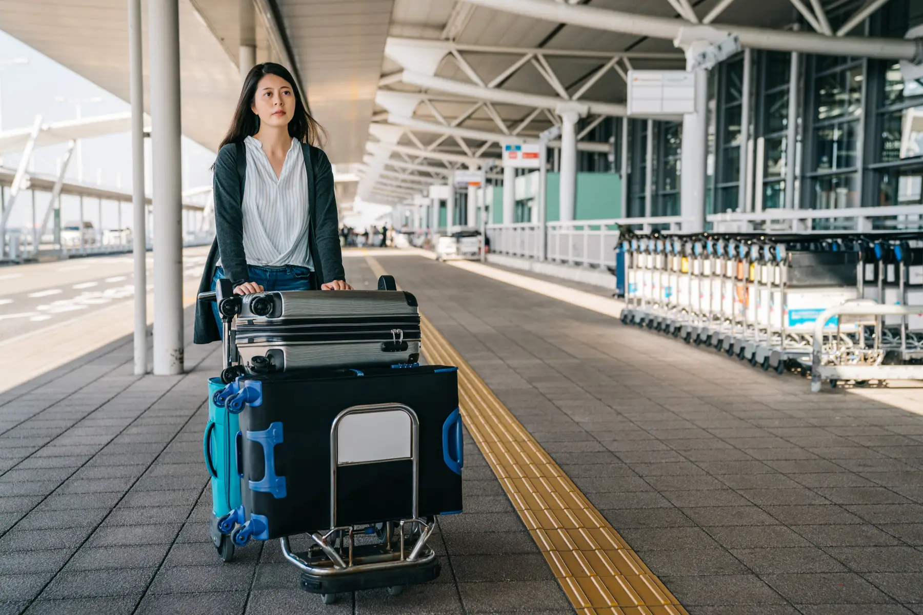 Woman with luggage at an airport