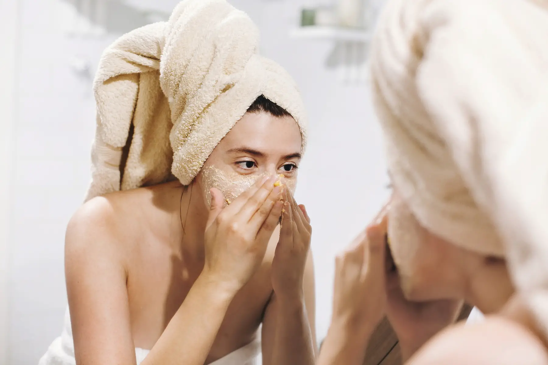 Woman using skin cream