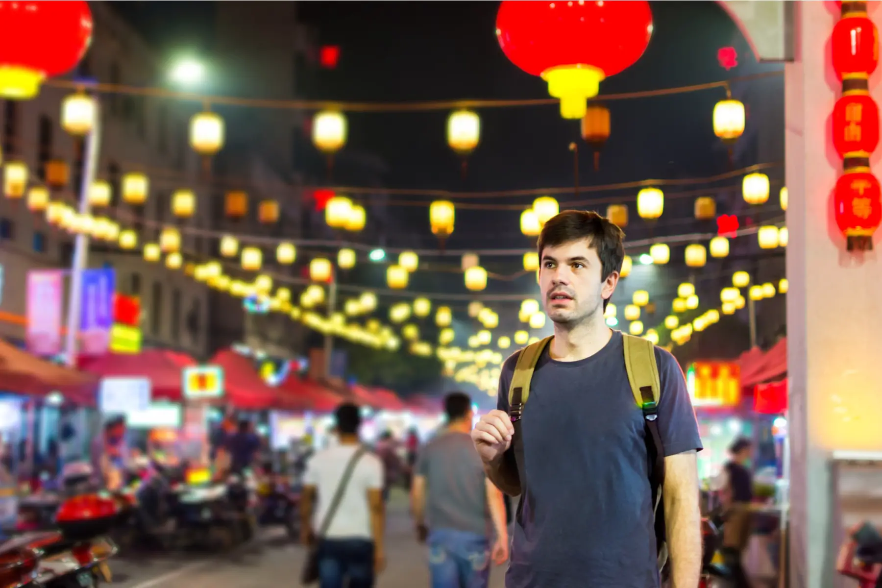Young man in an Asian city