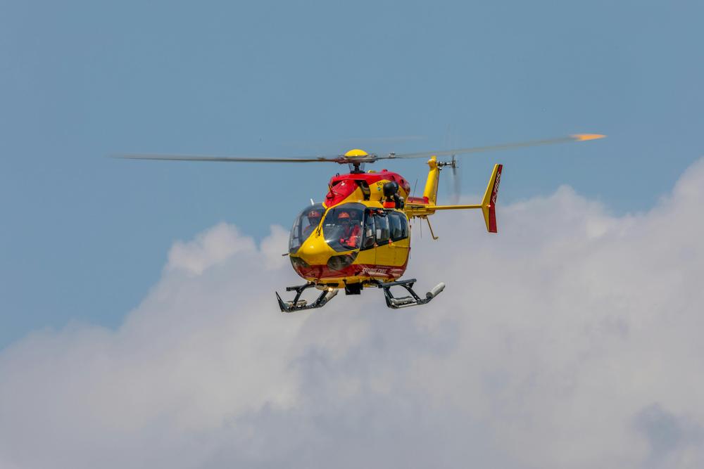 Emergency medical helicopter flying in the sky.