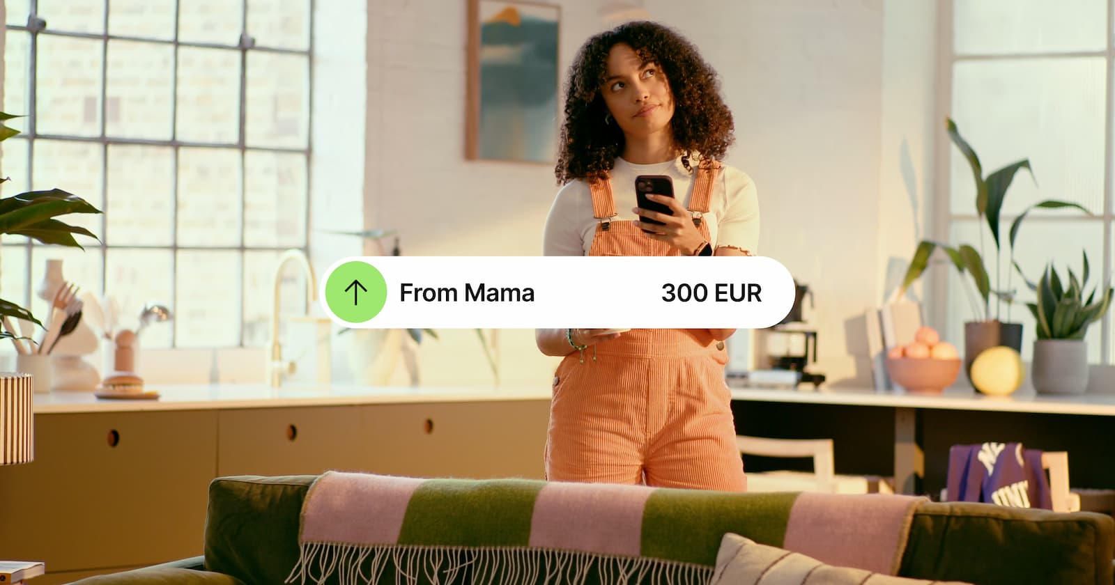 Image of a woman receiving money from abroad on her phone.