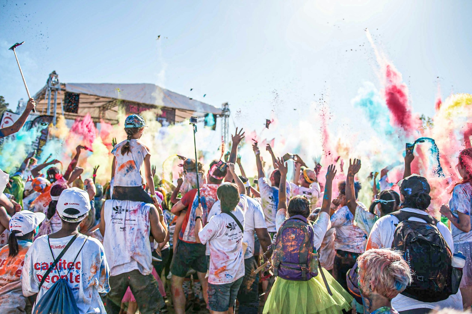 Annual Balekela Umbala (Color Run) with the backs of runners splashed with colors