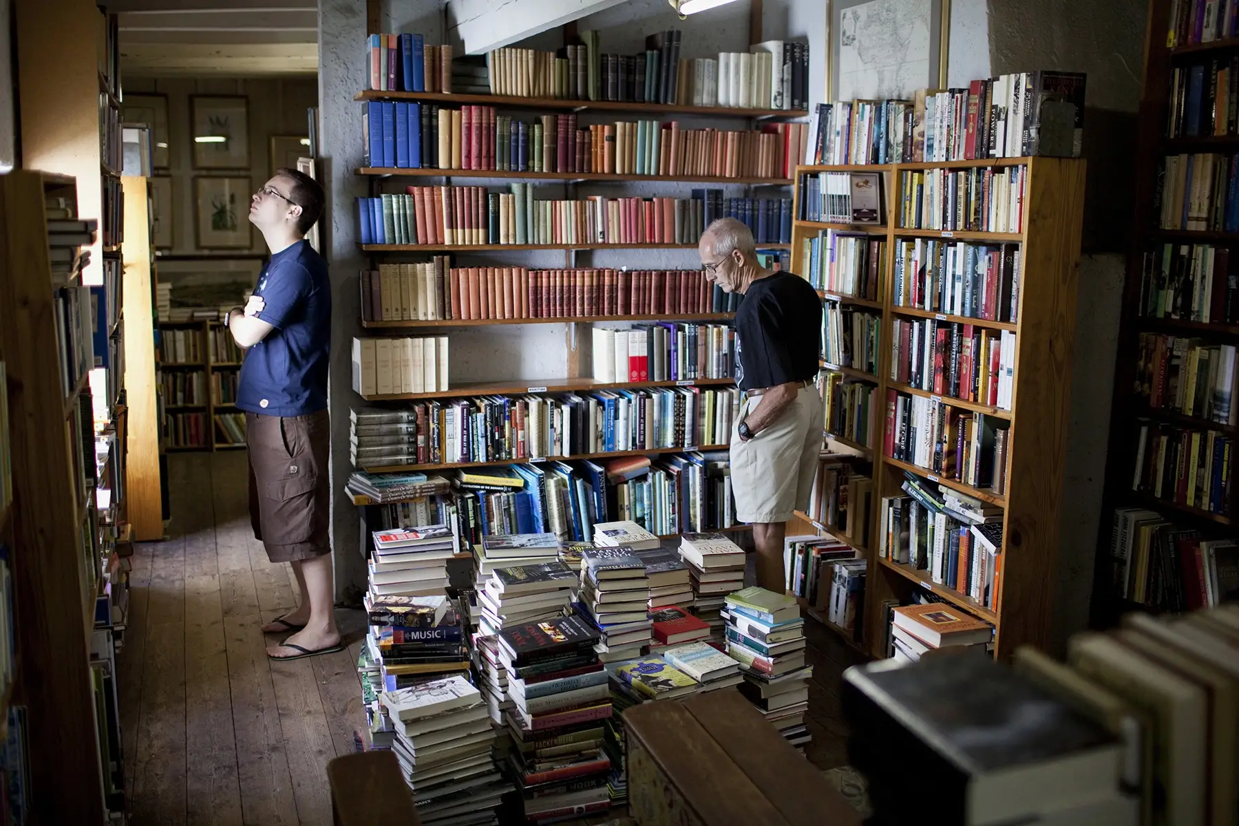 Customers looking for books at Bikini Beach Books, a well-known second-hand book shop in Gordon's Bay, South Africa