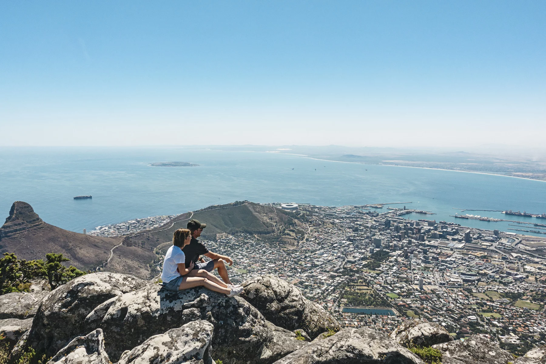 Couple taking in the view of Cape Town from Table Mountain